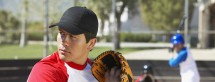 Man Playing Baseball in a Court, Wearing a Baseball Glove