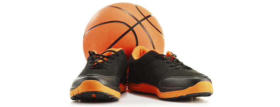 Basket ball and sneakers isolated on white
