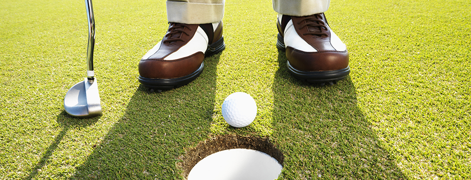 Middle-Aged Man Golfing